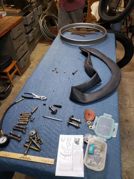 The tools of the tire shop trade.. vintage brass valve stems are in the bottom right..