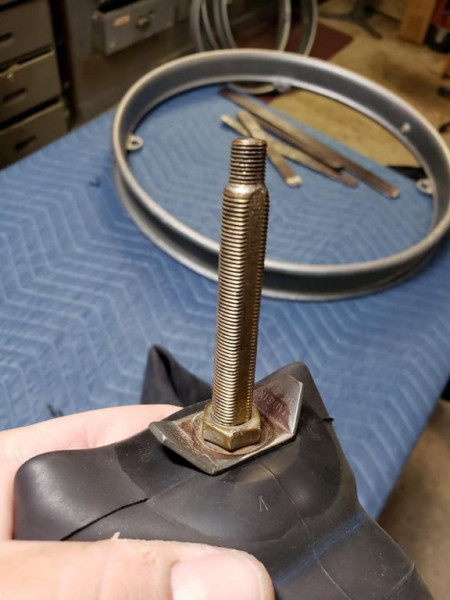 Inner retainer nut gets righted against the bridge washer and the stem flange inside the tube, creating an air tight fit.