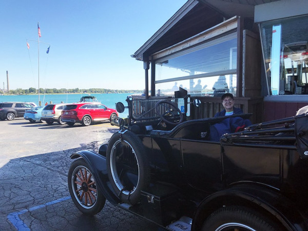 My wife and our Model T parked at the restaurant.  That's Canada across the river.
