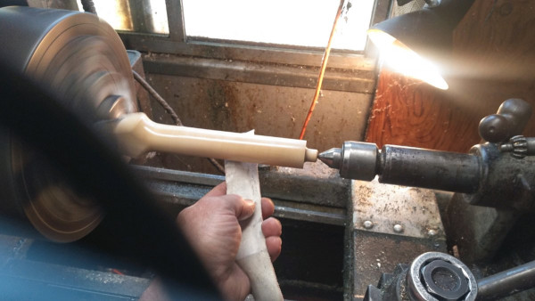 Spoke and Paper in the Lathe.JPG
