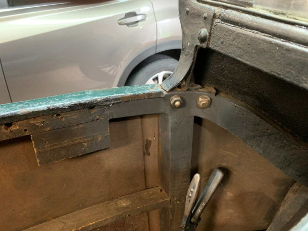Close up of driver side screw with repaired wood framework