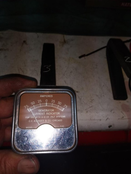 Magnet with max charge using a fixed core type charger touched to magnet ends.