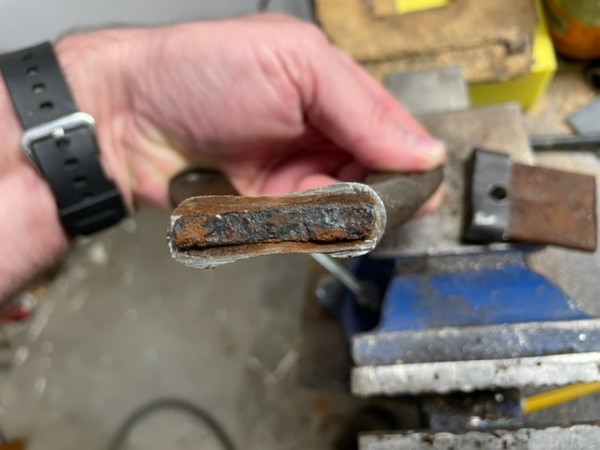 The rusted end of the old insert, just a crumble of rust that snapped in half.