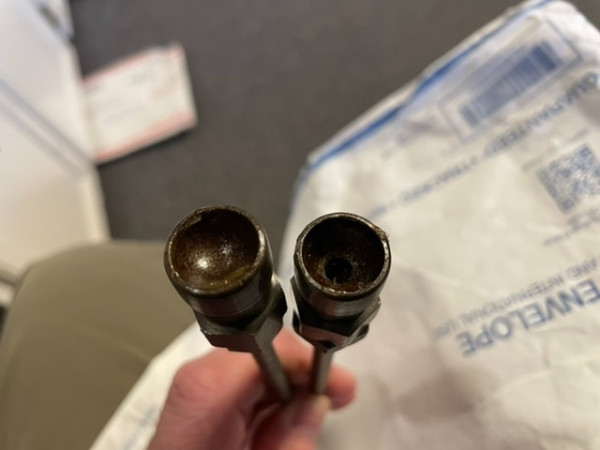 The two different styles of cups.  The one on the right has a hole all the way through it.