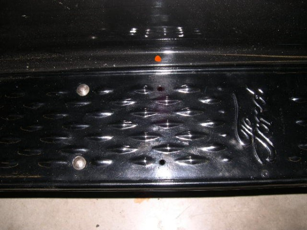 GAS HOSE HOLE--CENTER OF SPLASH SHIELD FLAT-MID 1912 THRU 1914.jpg
