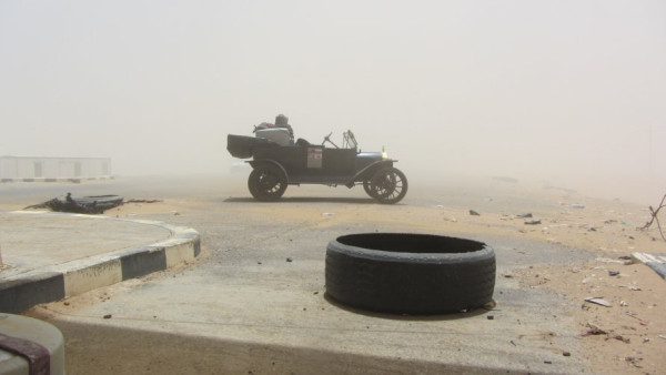This photo sums up the trip.  Very tough at times but also a hell of a lot of fun. The photo was taken at a police check point north of Khartoum in Sudan while waiting for a plains clothes State Security official to check my paperwork.  There was a war in the south of the country with South Sudan at the time over an oil rich border town.