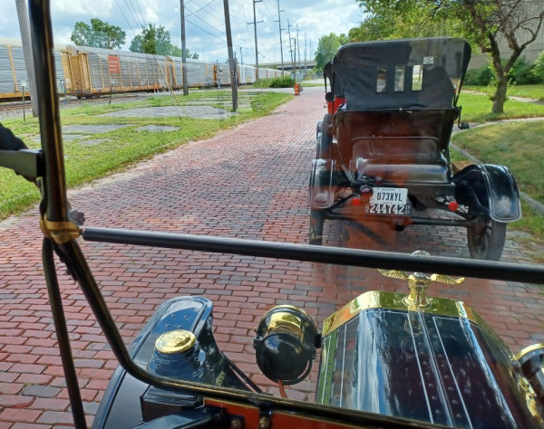 Waiting for stopped train in the shade. We had to find an alternate route to the restaurant!