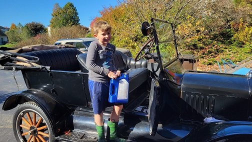 My son helping with an oil change