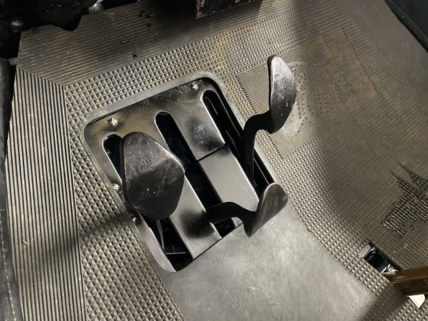 Pedals with the parking brake halfway back