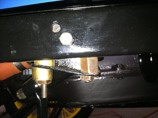 This shows the wedge spacers in the bracket that mounts to the frame.