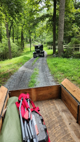 A T sedan following Dad and I thru the woods.