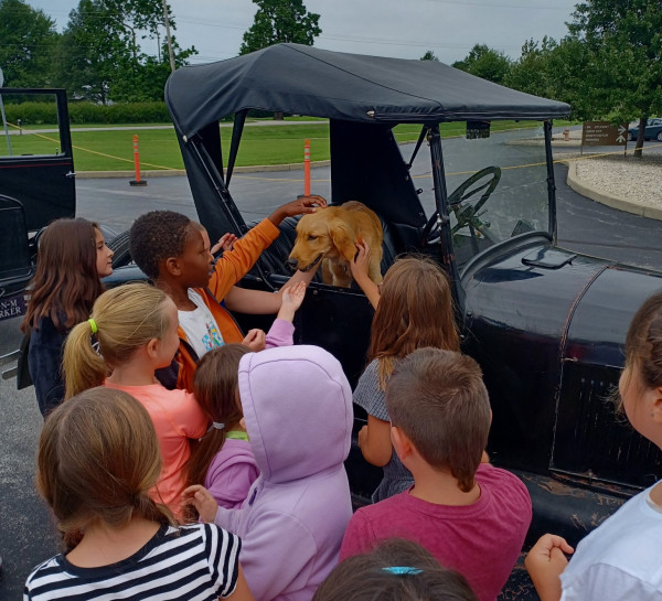 The kids loved the cars but they loved Jim's dog more!