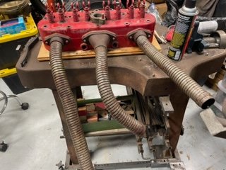 Exhaust manifold cast head with flex pipe