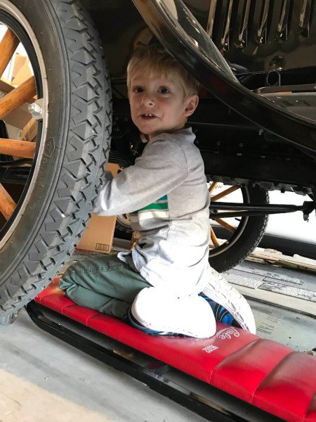 Kid working under T.jpg