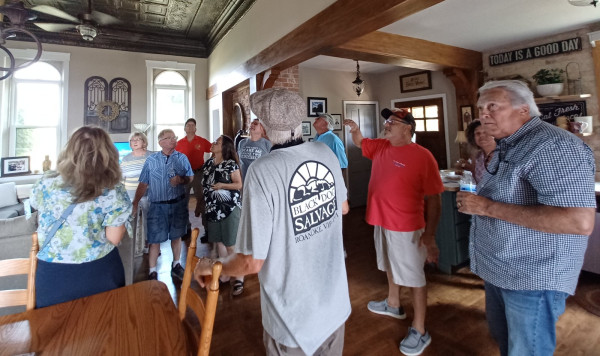 Rob Lucarelli-owner in red shirt- explains the house