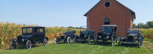 Our cars outside the schoolhouse