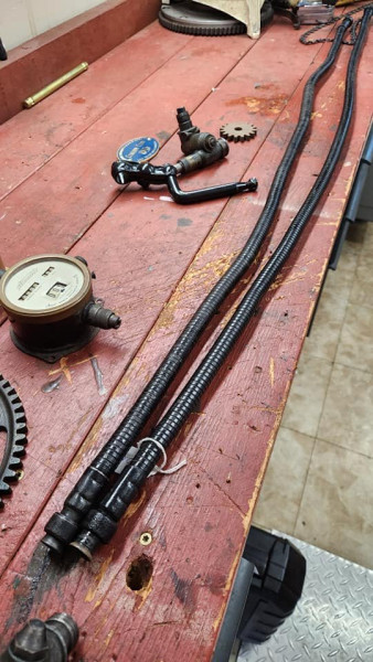 I also picked up a speedometer tube and cable... one dad has is next to it, his is shorter and may work better for my car and setup. The head and larger steel gear peaking in on the left are two pieces I already had.