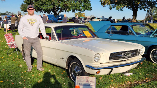 My other brother with his 1965 Ford Mustang. It was his first car and he's completed most of the work on it himself.
