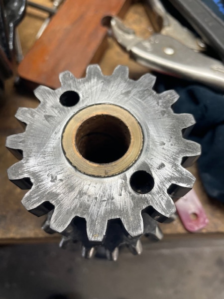End of the idler gear showing the worn bronze surface