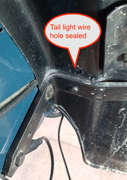 Tail light wire hole in fender_sealed.jpg