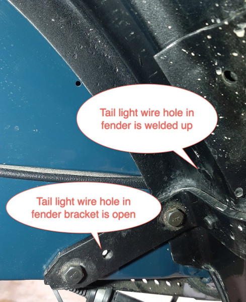 Tail light wire hole in fender bracket.jpg