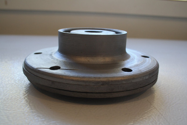 This side view is to show the amount of inset needed to factor in the bounce back.  This leaves the plate with a very subtle amount of cupping so that the plate has a slight claw edge to &quot;bite&quot; the spokes.