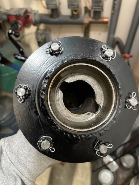 Castle nuts and cotter pins holding the front pins.