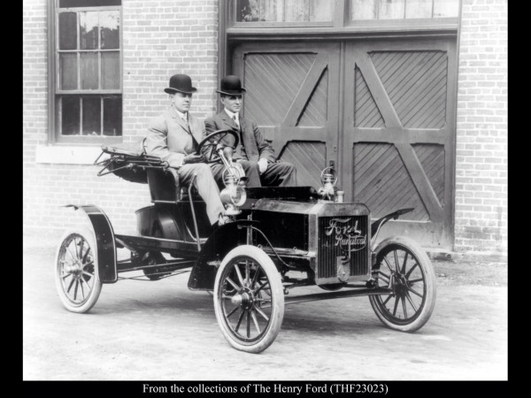 Henry Ford with prototype N and driver 1906.jpeg