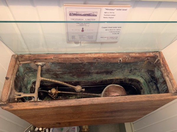 1205 Toilet tank & sign mres.jpg