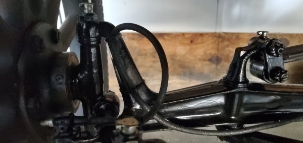 Use black tarred wire loom to protect the wires and sort of make it look like a belongs there