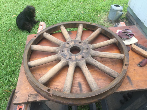 Rear wheel during stripping process under the careful supervision of Buddy.