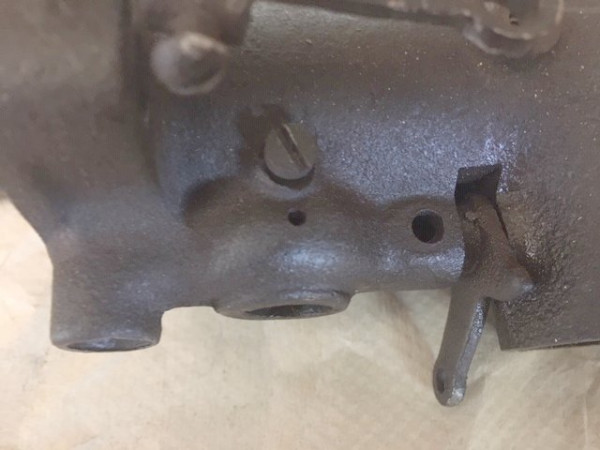 Small vent hole into chamber aroumnd inlet tube.