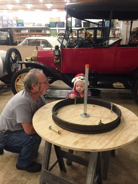 Harper helping on tire table.jpeg