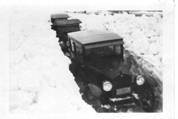 Trail was not kept open in winter until 1929, so the young men would shovel it. This photo taken 1926.