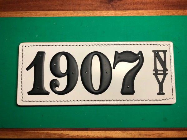 Example of our new &quot;BLACK ON WHITE&quot; leather plate.  It's an option, the majority of our plate are aluminum on a black leather base.