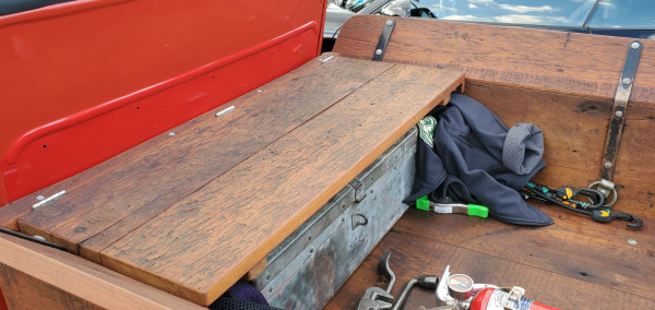 Rear bench seat with tool Box underneath.