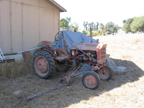 cub tractor behind barn.jpg