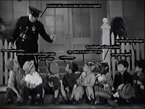 12 cop shakes finger at 8 rascals b.jpg