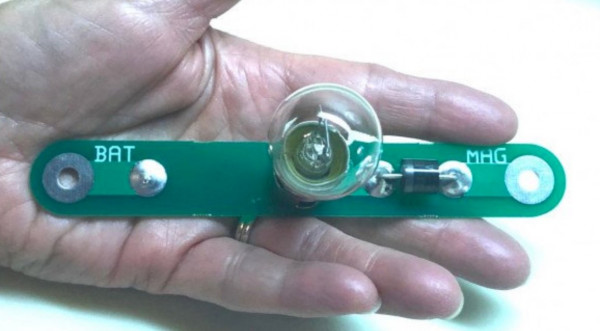 John Regan produced this neat little charger board that spans the battery and magneto posts on the firewall