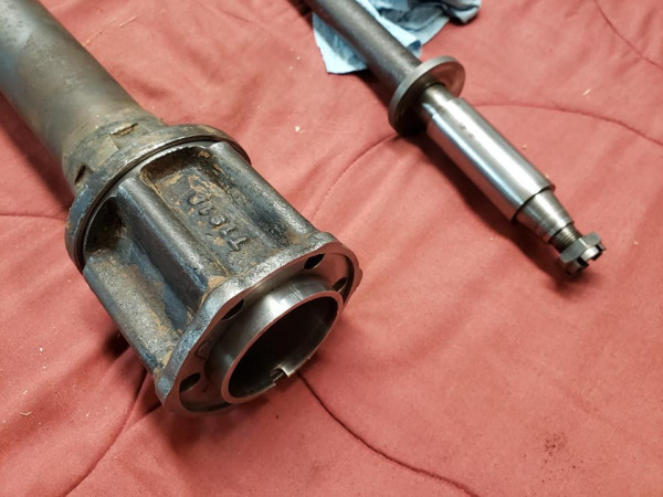 The housing and spool. The silver end of the driveshaft to the right rides on a bearing in the spool to the left.