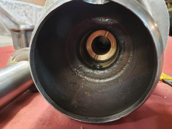 New brass bushing installed in the housing.