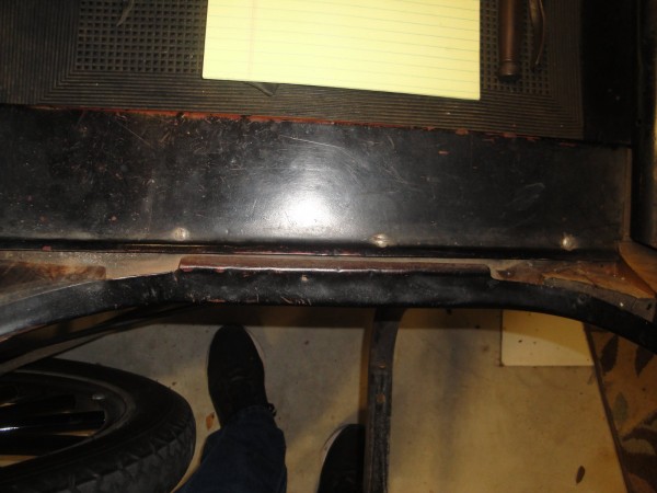 Looking down on the right rear threshold