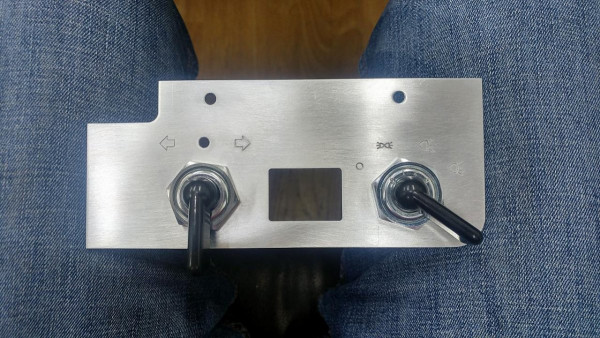 This is my self made dashboard. Inside the window I have a LCD display for showing me speed and battery voltage (alternating, when battery becomes critical). It is mounted below the left corner of the windshield and looks lots better and more decent than this ugly chrome thing on steering column.